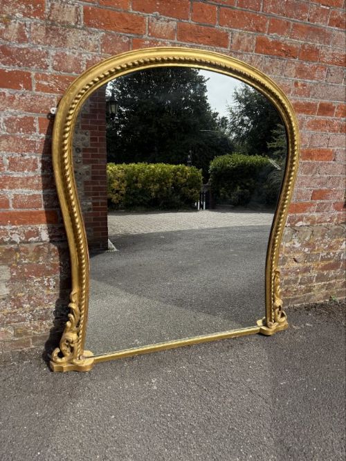 An Exceptional large Antique English 19thC gilt hour glass ribbed framed Overmantle Mirror.