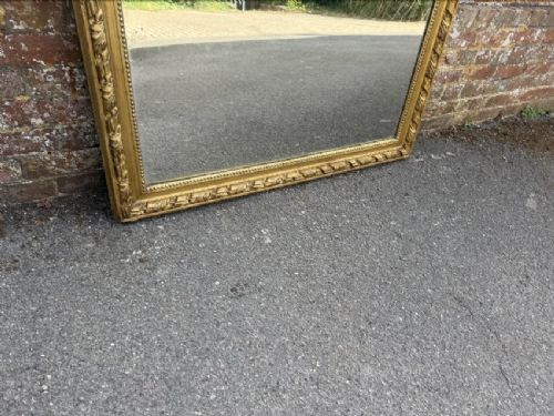 A large 19th-century French rectangular mirror featuring a carved gold leaf frame adorned with a rope twist border and a decorative foliage crest. View IV