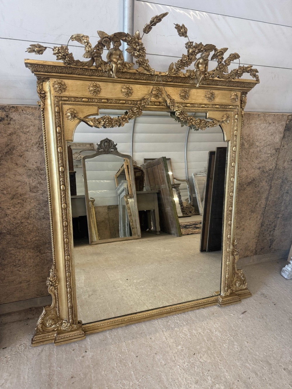 An Exceptional large Antique English 19th Century Gilt Overmantle Mirror.