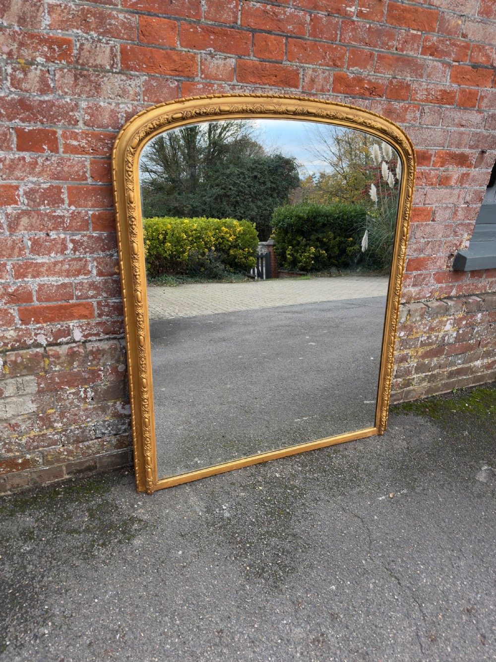 A Fabulous large Antique English 19th Century arched top gilt Overmantle Mirror.