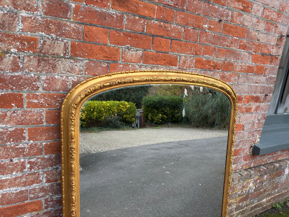 A Fabulous large Antique English 19th Century arched top gilt Overmantle Mirror. View IV