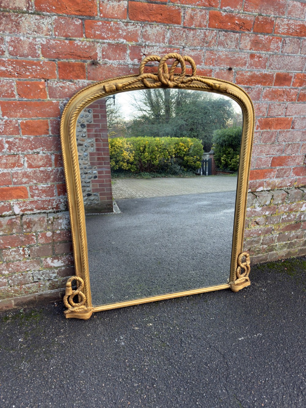 A Spectacular large Antique English 19th Century arched top gilt rope twist framed Overmantle Mirror.
