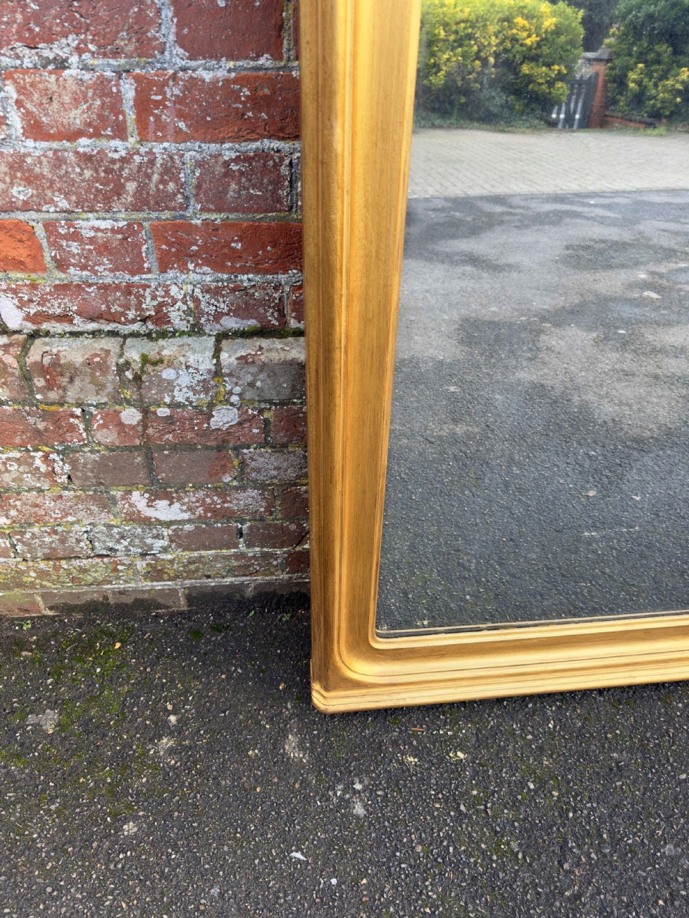 A tall 19th-century giltwood full-length mirror featuring a shaped arched top and continuous moulded frame. View IV