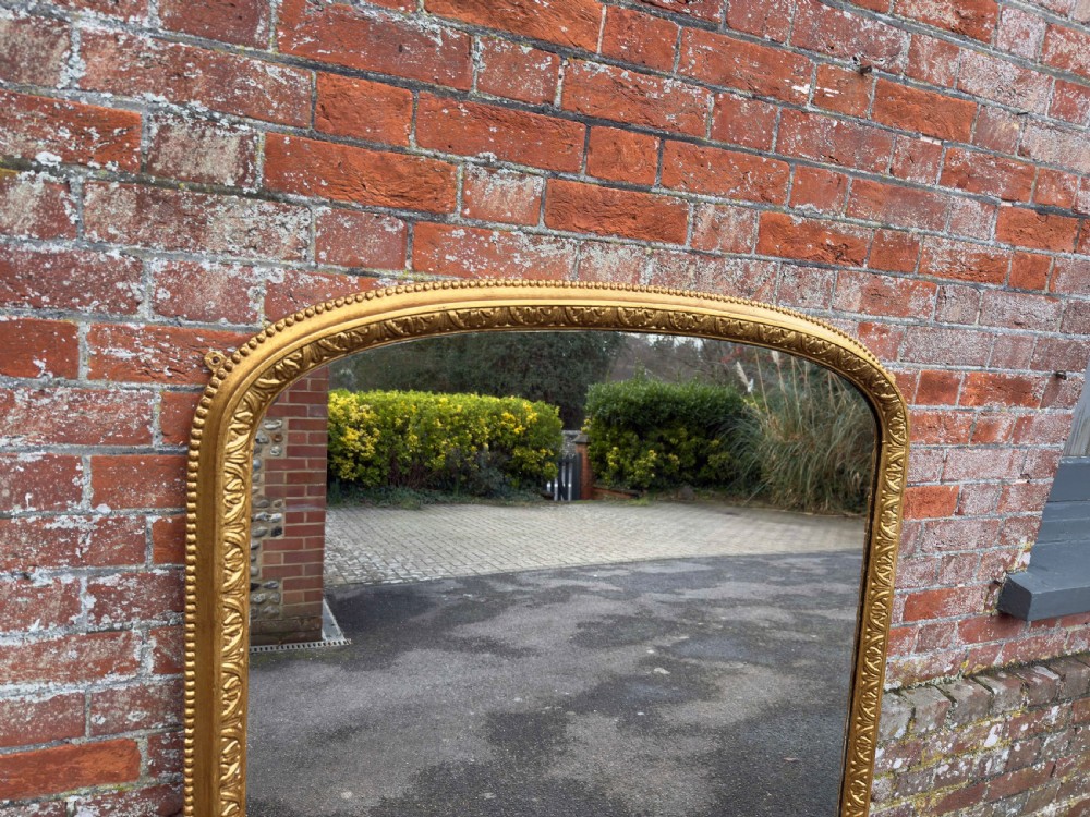 A Stunning large Antique English 19th Century carved wood & gesso arched top gilt Overmantle Mirror. View II