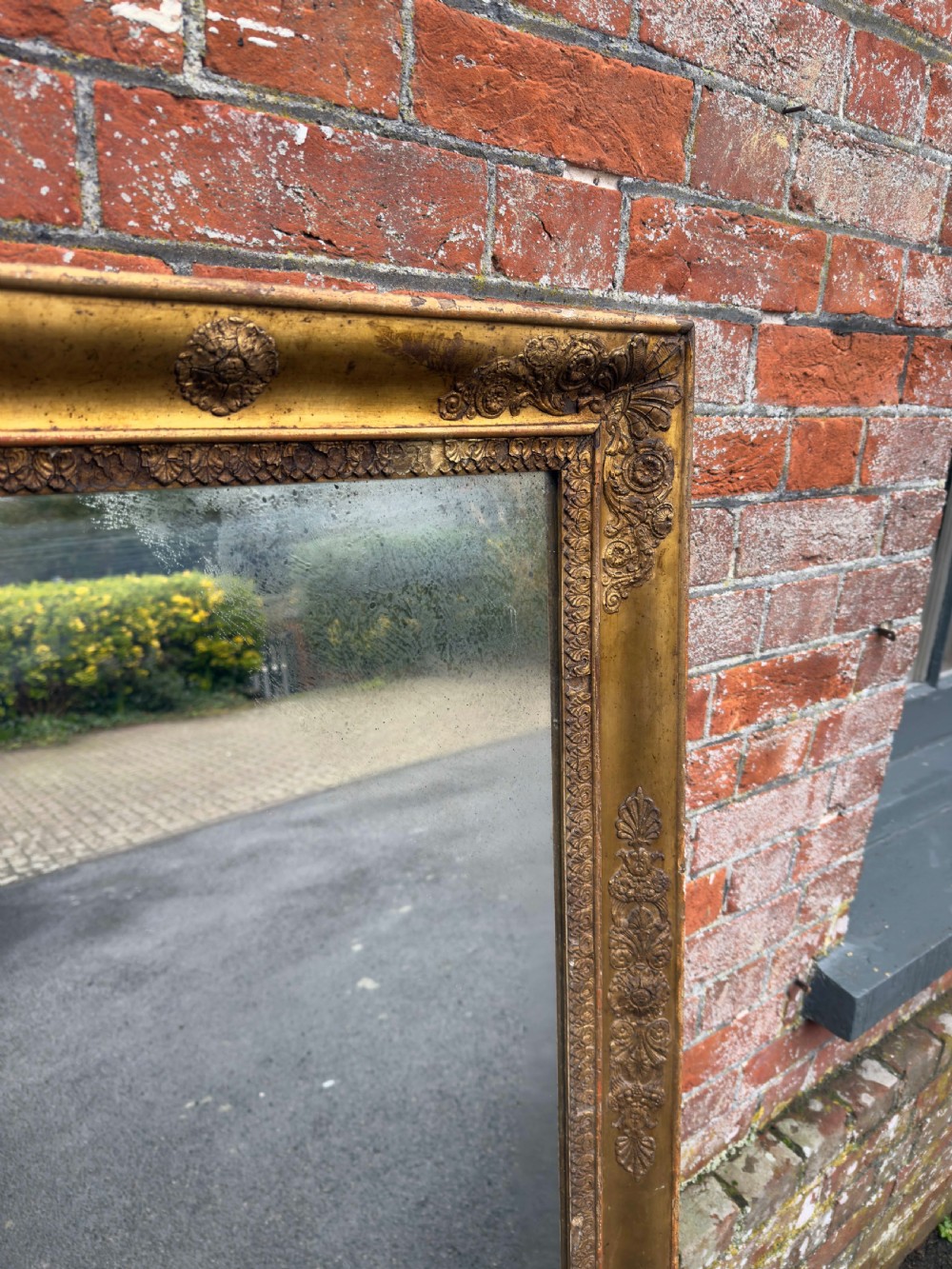 A large rectangular French 19th-century giltwood and gesso mirror featuring carved foliate mouldings and corner details. View II
