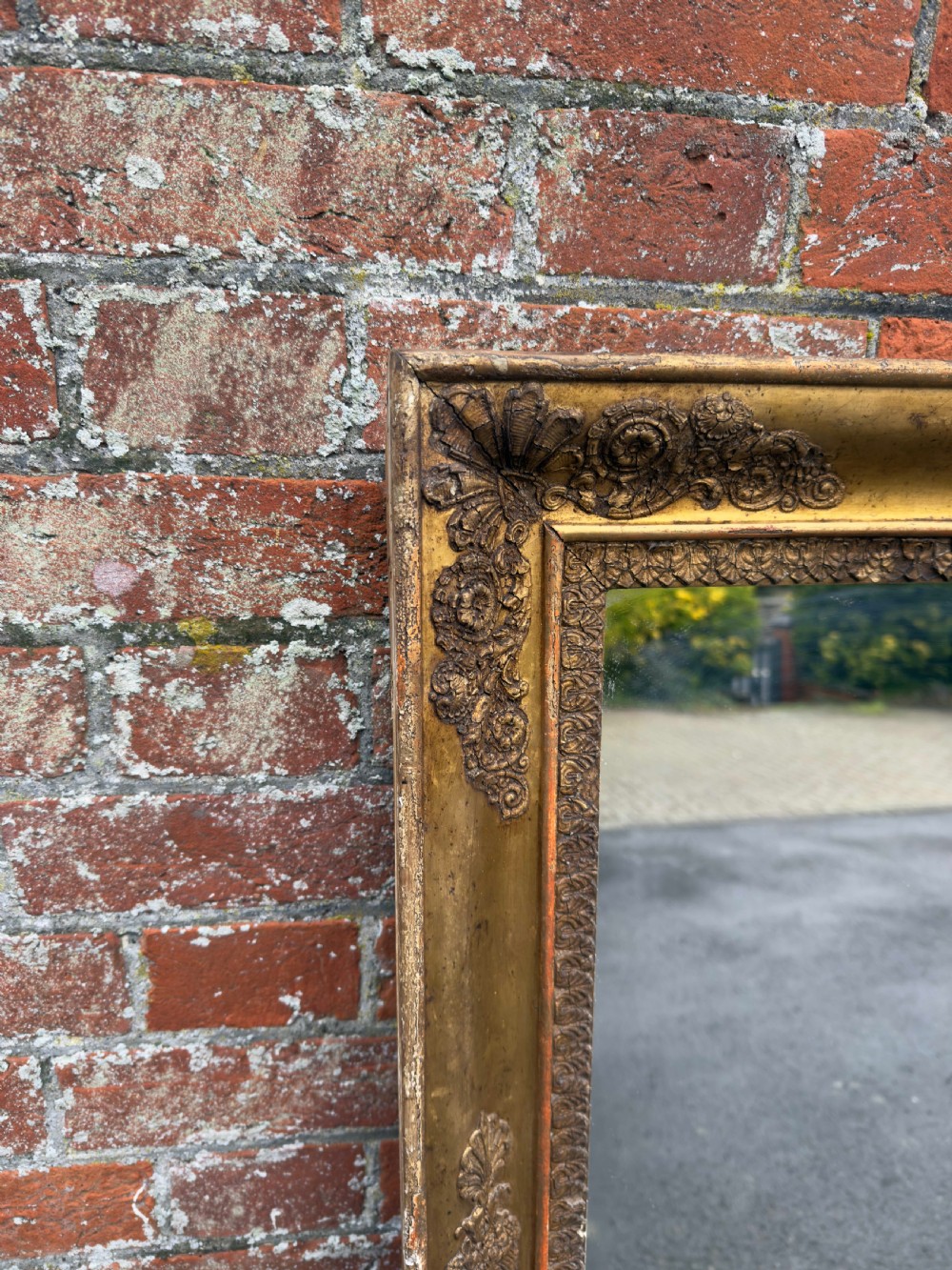 A large rectangular French 19th-century giltwood and gesso mirror featuring carved foliate mouldings and corner details. View III
