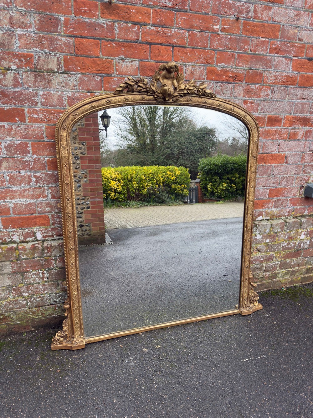 A Specatular large Antique English 19th Century carved wood & gesso arched top gilt Overmantle Mirror.