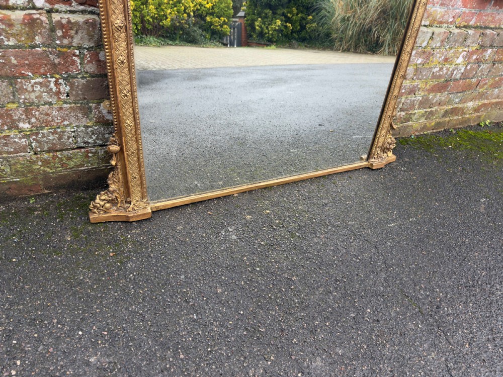 A Specatular large Antique English 19th Century carved wood & gesso arched top gilt Overmantle Mirror. View IV