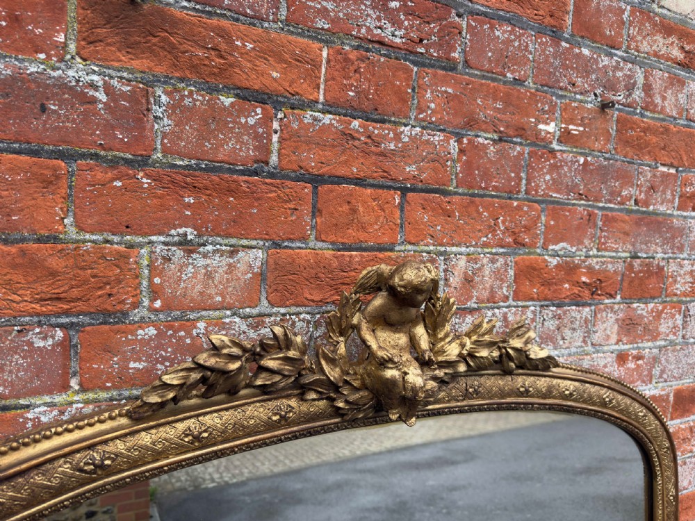 A Specatular large Antique English 19th Century carved wood & gesso arched top gilt Overmantle Mirror. View VII