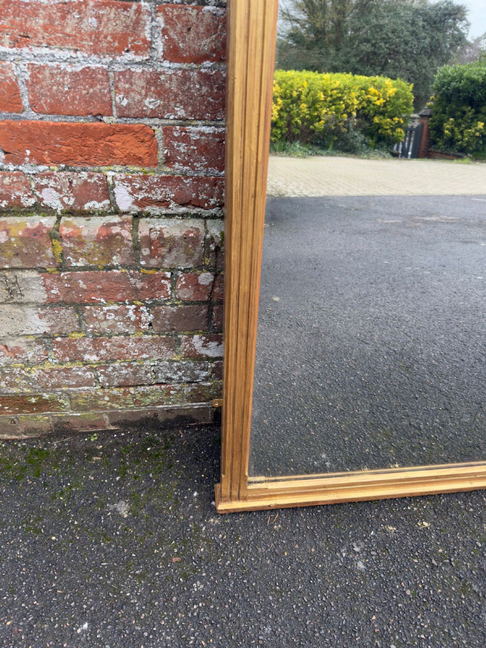 A large 19th-century rectangular gilt wood overmantel mirror featuring a upper spindle gallery and corner finials. View III