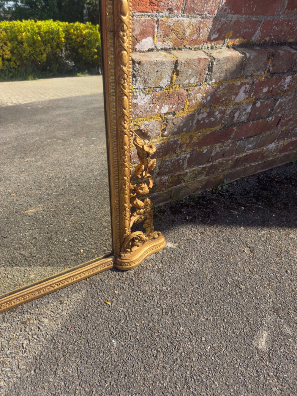 A large nineteenth-century rectangular giltwood overmantel mirror featuring ornate cresting with a bird motif and scrolled foliate moulding along the frame. View IV