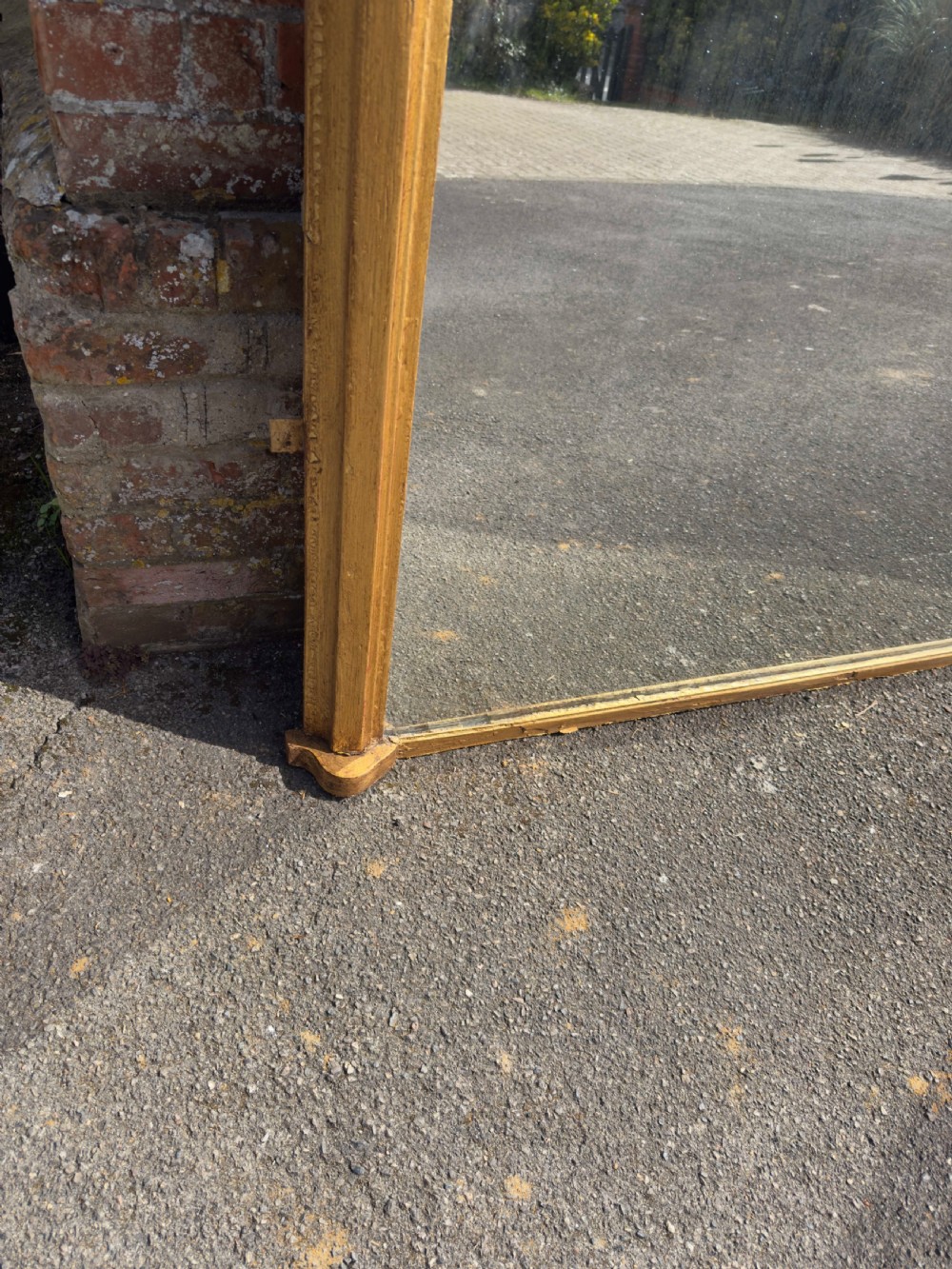 A large 19th-century arched overmantel mirror featuring a gilded wood and gesso frame with rounded top corners and subtle moulding details. View III