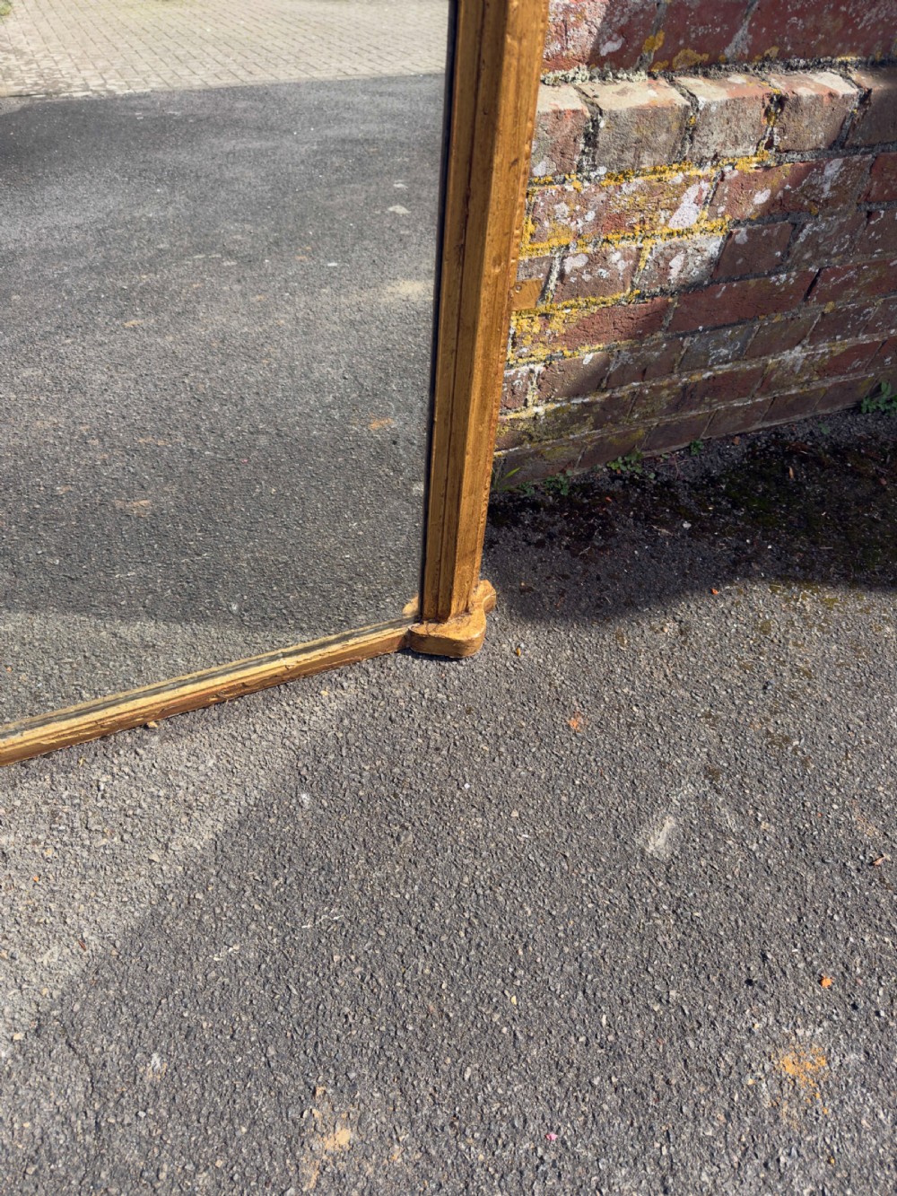 A large 19th-century arched overmantel mirror featuring a gilded wood and gesso frame with rounded top corners and subtle moulding details. View IV
