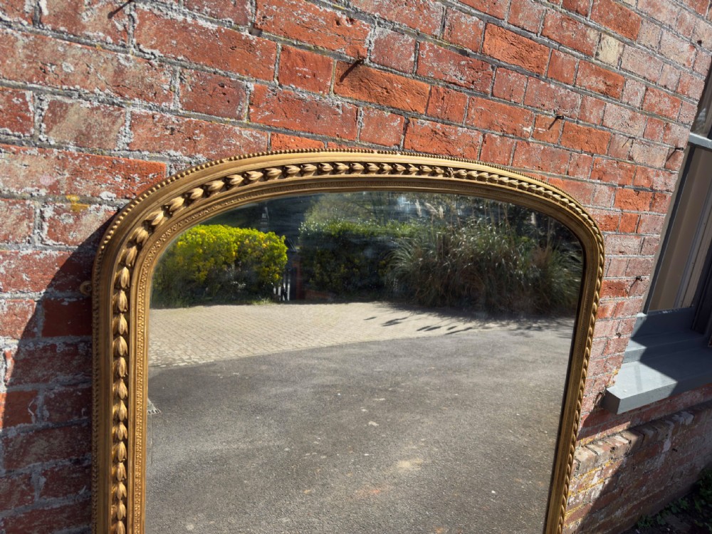 A Spectualar Large Antique English 19th Century carved wood & gesso arched top gilt Tulip framed Overmantel Mirror. View II