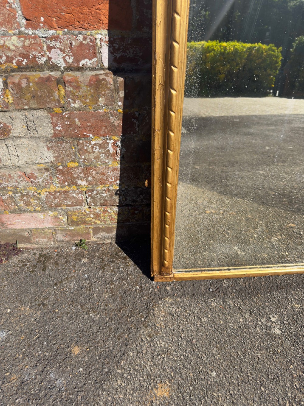 A 19th-century arched overmantel mirror featuring a gold giltwood rope-twist frame and original foxed glass. View IV