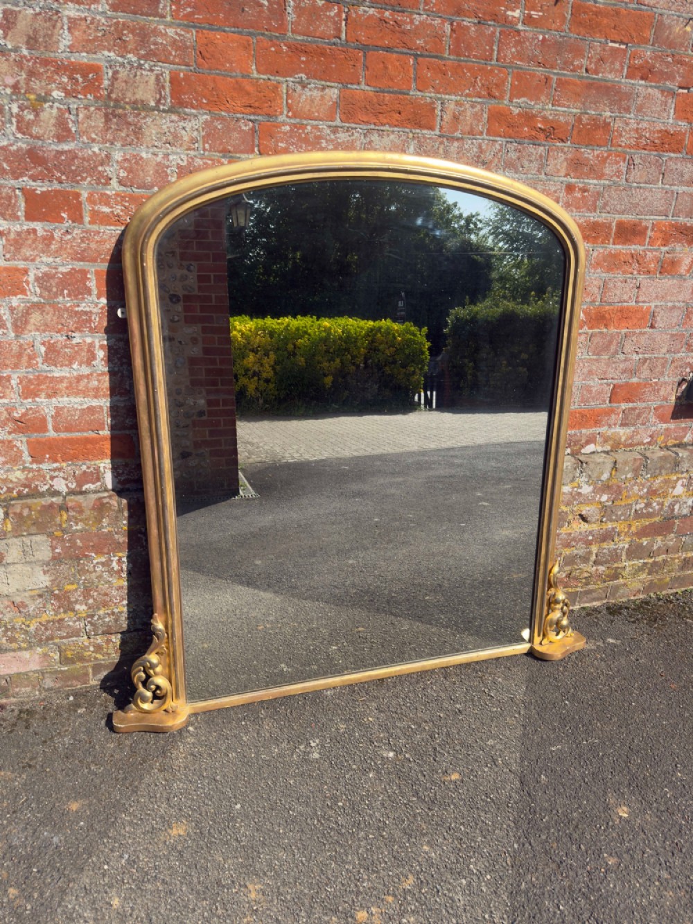 An Exceptional large Antique English 19th Century arched top gilt Overmantel Mirror.