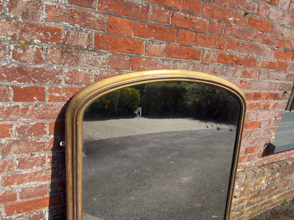 An Exceptional large Antique English 19th Century arched top gilt Overmantel Mirror. View II