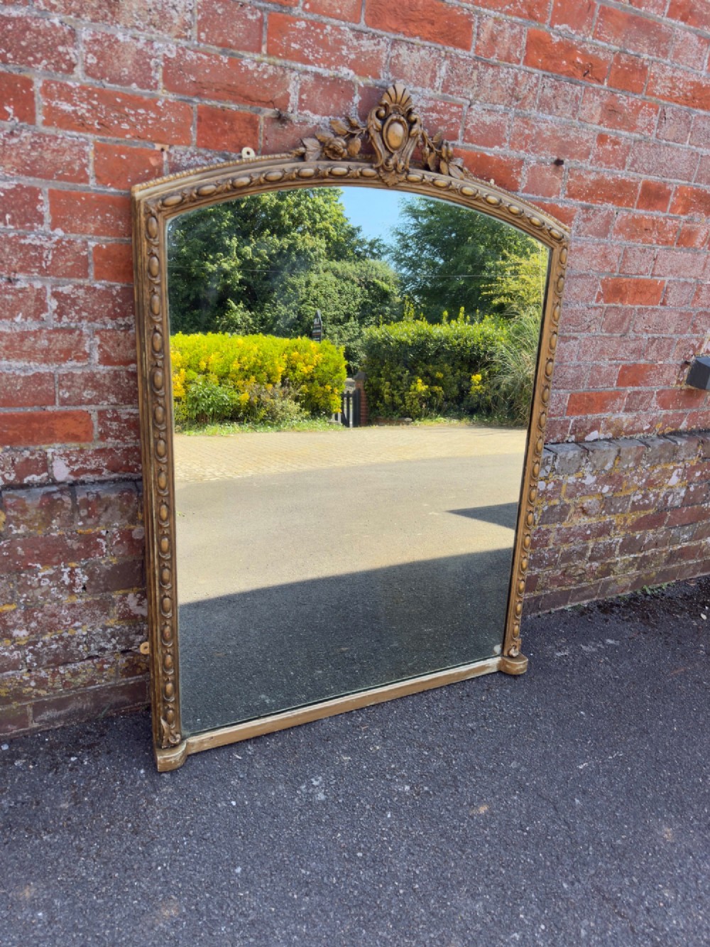 A Fabulous large Antique English 19th Century carved wood & gesso shaped top gilt Overmantle Mirror.