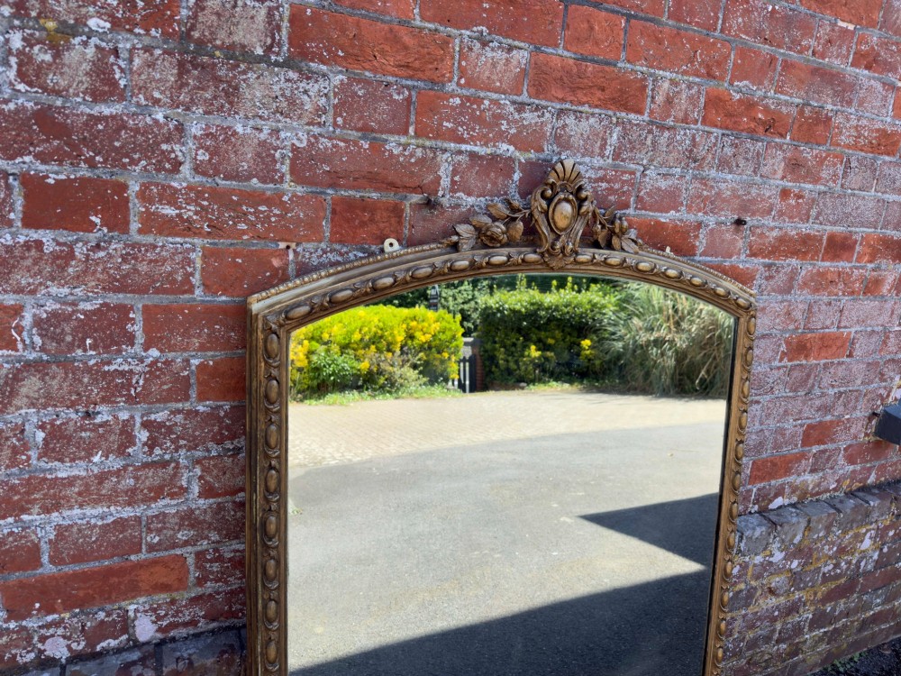 A Fabulous large Antique English 19th Century carved wood & gesso shaped top gilt Overmantle Mirror. View IV