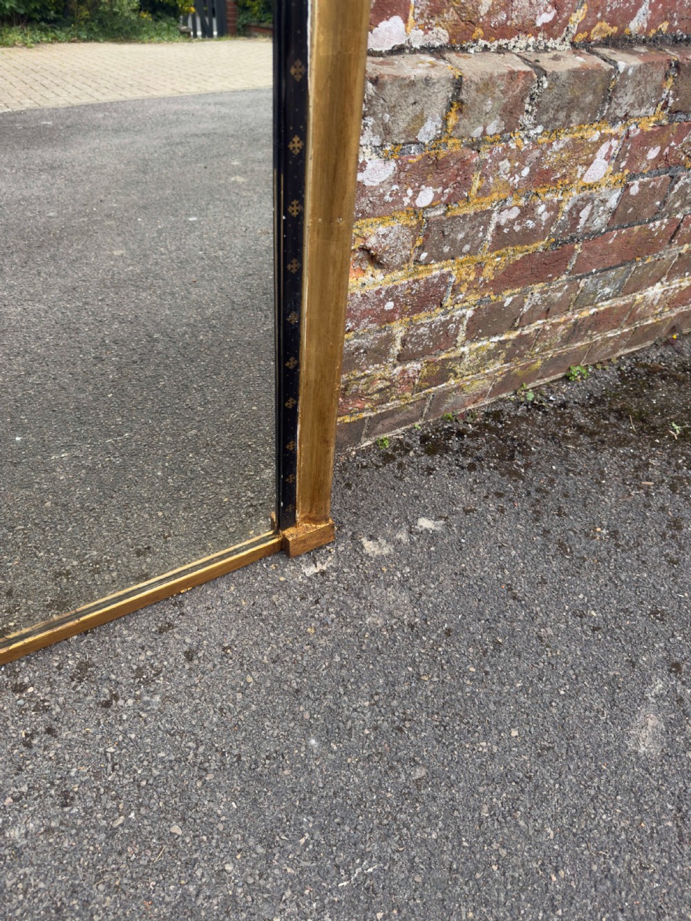 A large Victorian arched overmantel mirror featuring a gilded wood frame with a dark inner border detailing. View IV