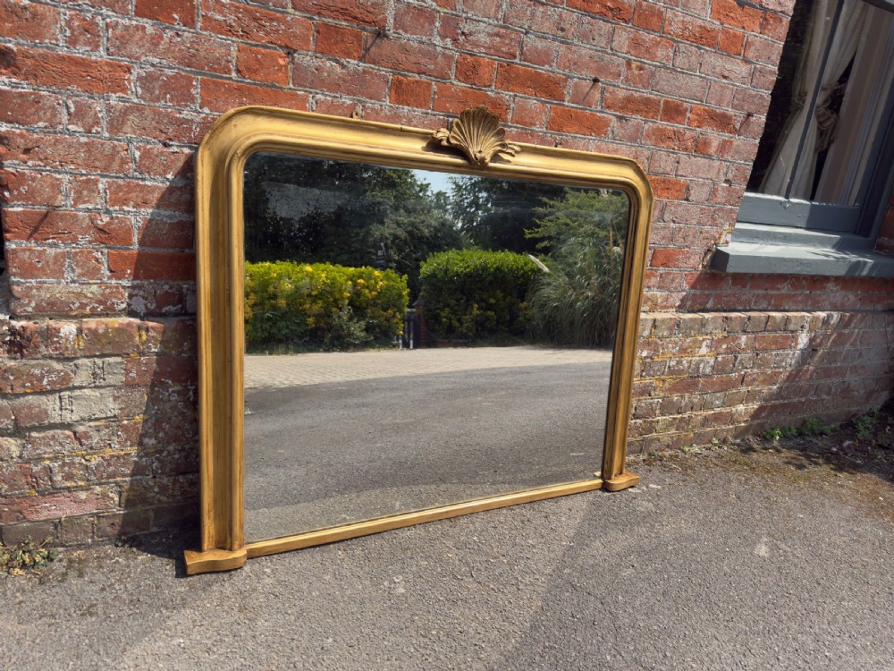 A Superb good size Antique English 19th Century arched top carved wood and gesso gilt Overmantle Mirror.