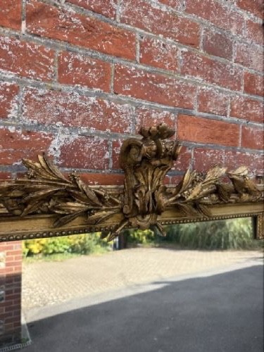 A large 19th-century French rectangular mirror featuring a carved gold leaf frame adorned with a rope twist border and a decorative foliage crest. View II