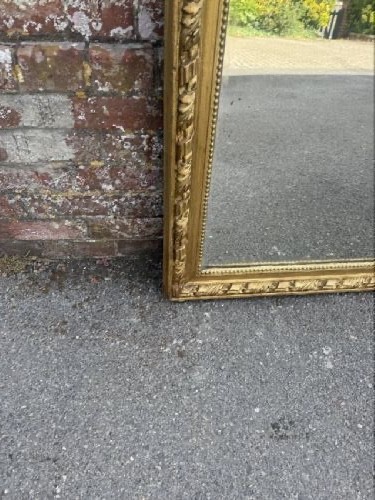 A large 19th-century French rectangular mirror featuring a carved gold leaf frame adorned with a rope twist border and a decorative foliage crest. View V