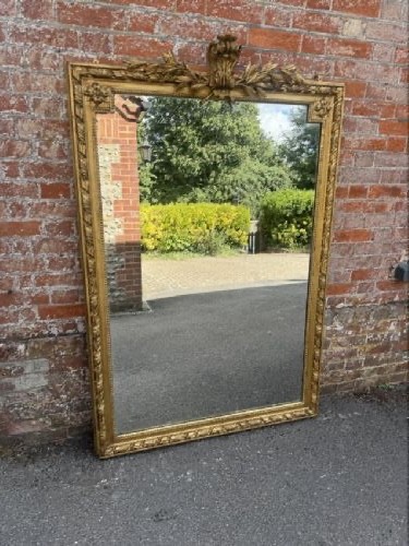 A large 19th-century French rectangular mirror featuring a carved gold leaf frame adorned with a rope twist border and a decorative foliage crest. View VII