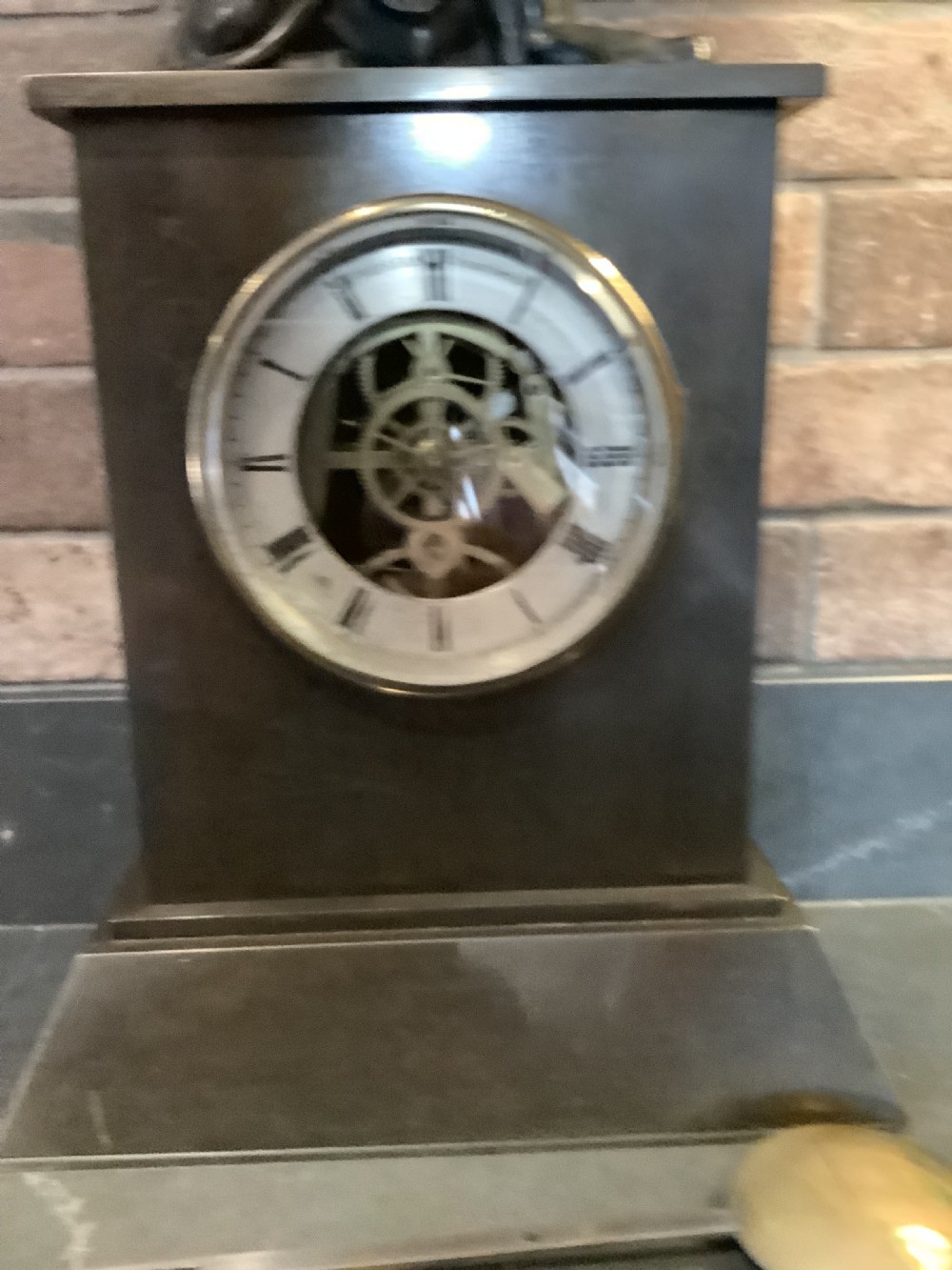A Victorian patinated bronze mantel clock featuring an open skeleton dial signed Frodsham Gracechurch Street alongside a brass pendulum and winding key. View XVI