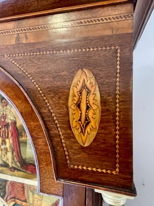 fig 7. An antique Scottish Georgian mahogany longcase clock featuring a hand-painted dial, spiral turned columns, and marquetry inlay.