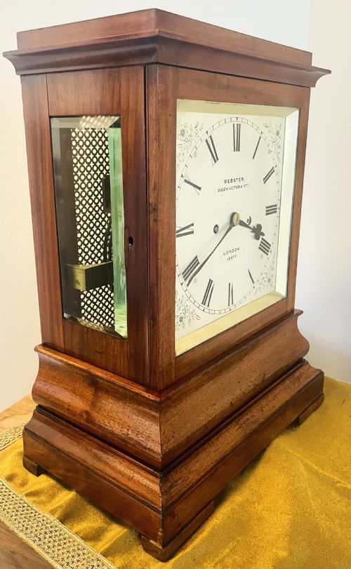 fig 1. A Victorian mahogany four-glass bracket clock featuring a white dial with Roman numerals and a moulded stepped base.