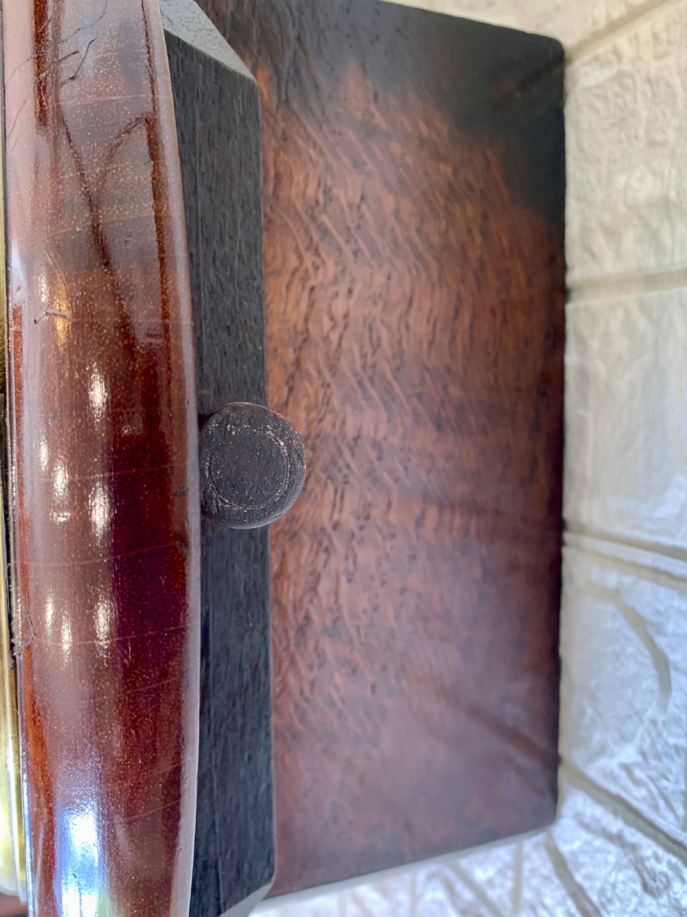 An antique circular mahogany wall clock featuring a cream dial with black Roman numerals and British Railways lettering, framed by a brass bezel. View XVII