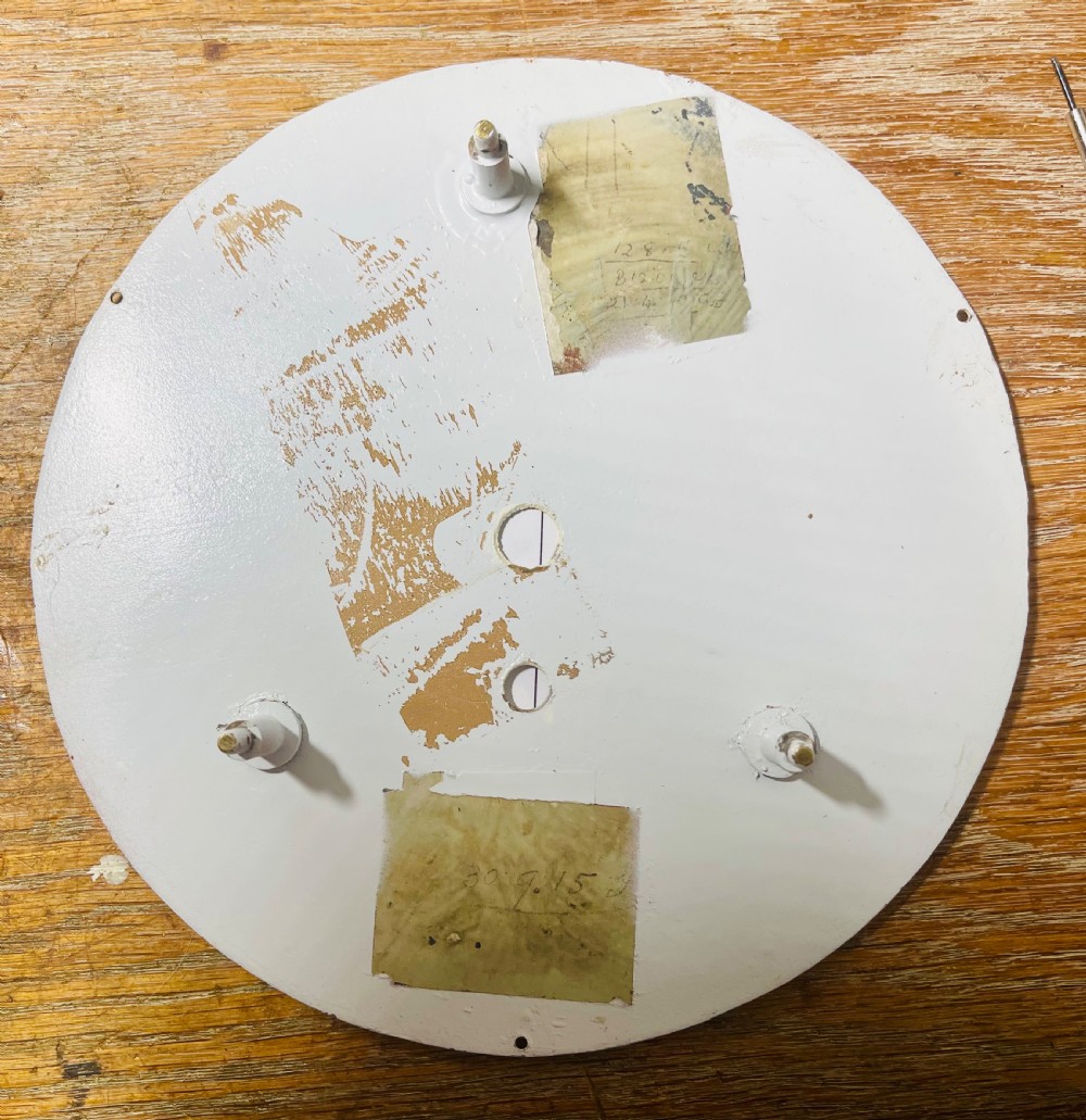 A circular mahogany wall clock with a brass bezel, off-white dial displaying Roman numerals, and London Midland and Scottish Railway branding. View XII