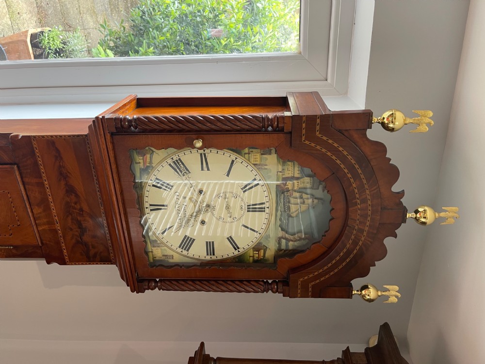 An antique Welsh mahogany longcase clock featuring a painted dial with a rocking ship automaton arch and brass finials. View VII