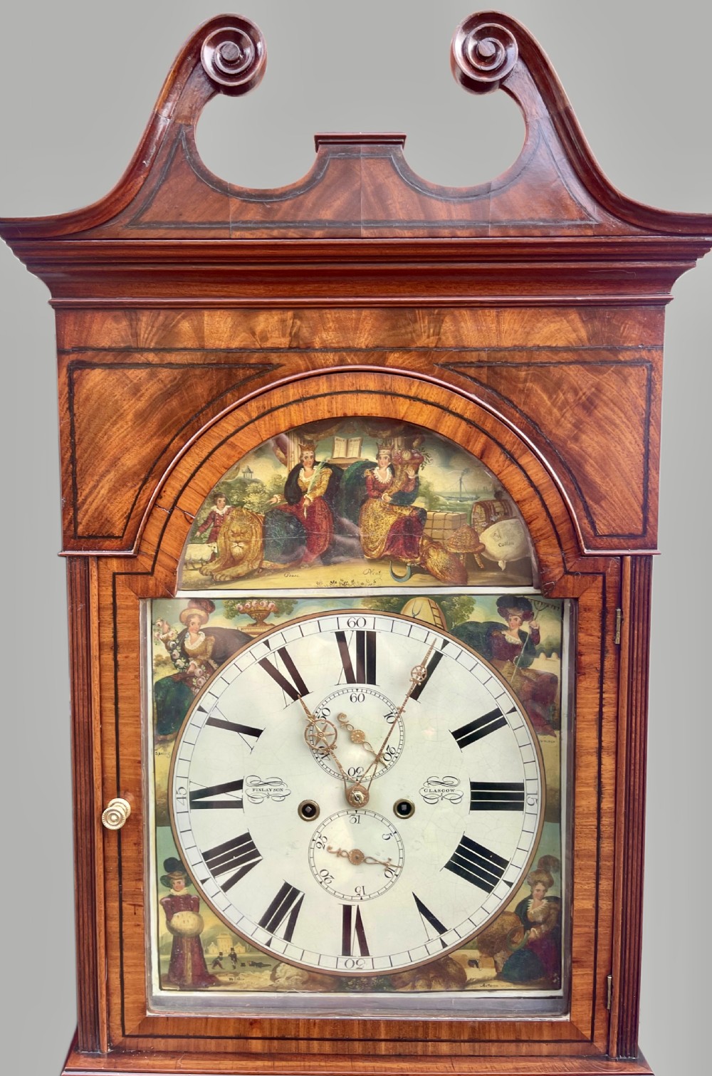 A Georgian flame mahogany longcase clock featuring a swan-neck pediment and a hand-painted arch dial. View V