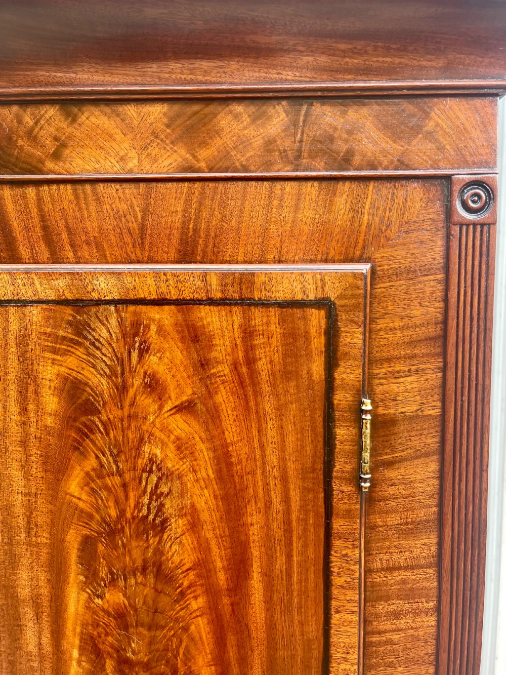 A Georgian flame mahogany longcase clock featuring a swan-neck pediment and a hand-painted arch dial. View XIX