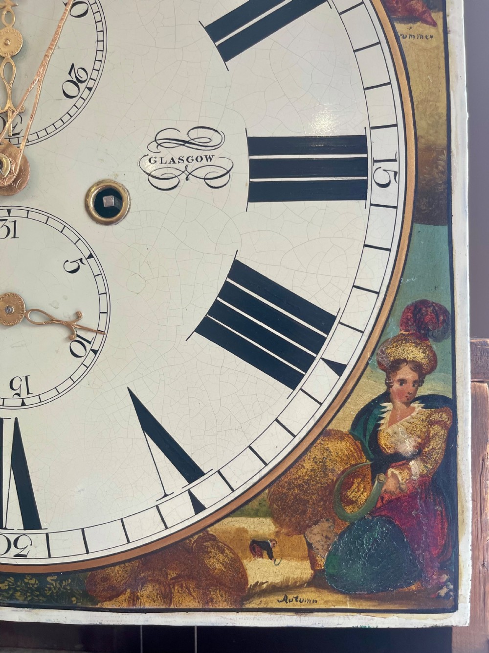 A Georgian flame mahogany longcase clock featuring a swan-neck pediment and a hand-painted arch dial. View XXII