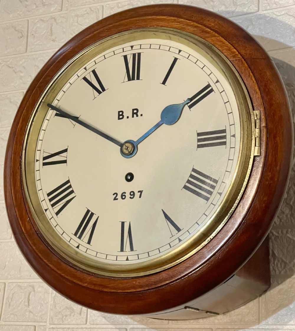 A circular antique mahogany fusee wall clock featuring a cream dial marked B.R., Roman numerals, black hands, and a brass bezel. View X
