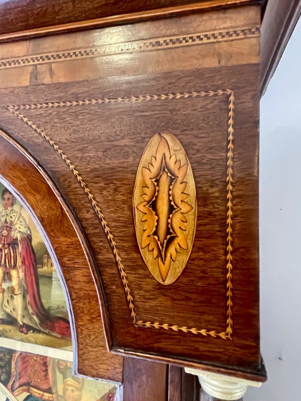 An antique Scottish Georgian mahogany longcase clock featuring a hand-painted dial, spiral turned columns, and marquetry inlay. View VIII