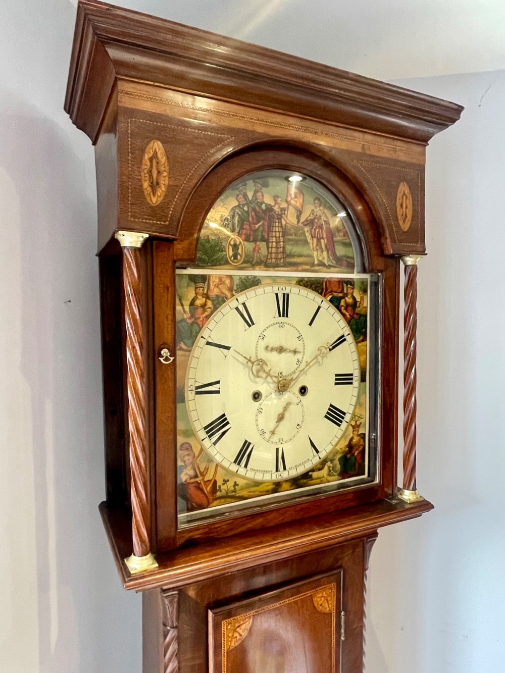 An antique Scottish Georgian mahogany longcase clock featuring a hand-painted dial, spiral turned columns, and marquetry inlay. View XI