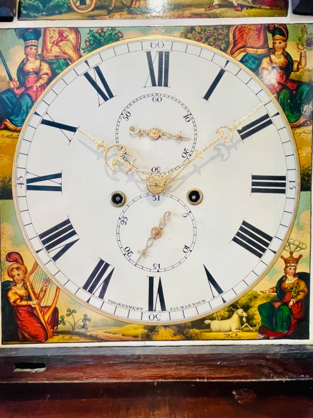 An antique Scottish Georgian mahogany longcase clock featuring a hand-painted dial, spiral turned columns, and marquetry inlay. View XIV