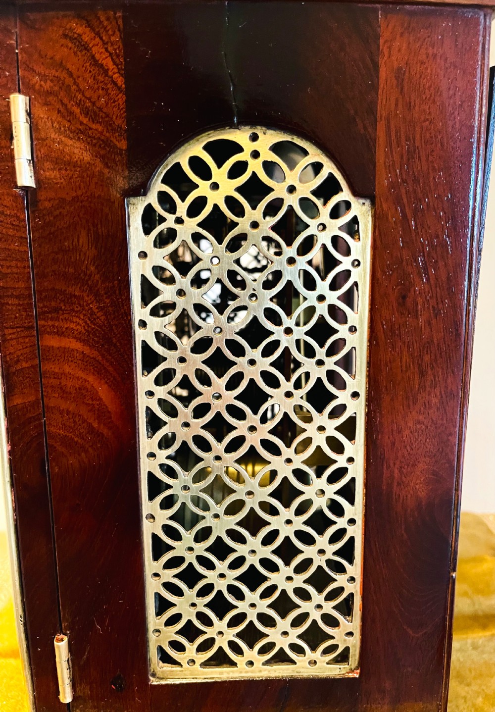 A George III mahogany bracket clock featuring an arched case with a brass top handle, gilt spandrels, and a silvered dial. View XI