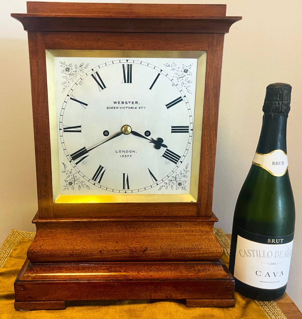 A Victorian mahogany four-glass bracket clock featuring a white dial with Roman numerals and a moulded stepped base. View VII