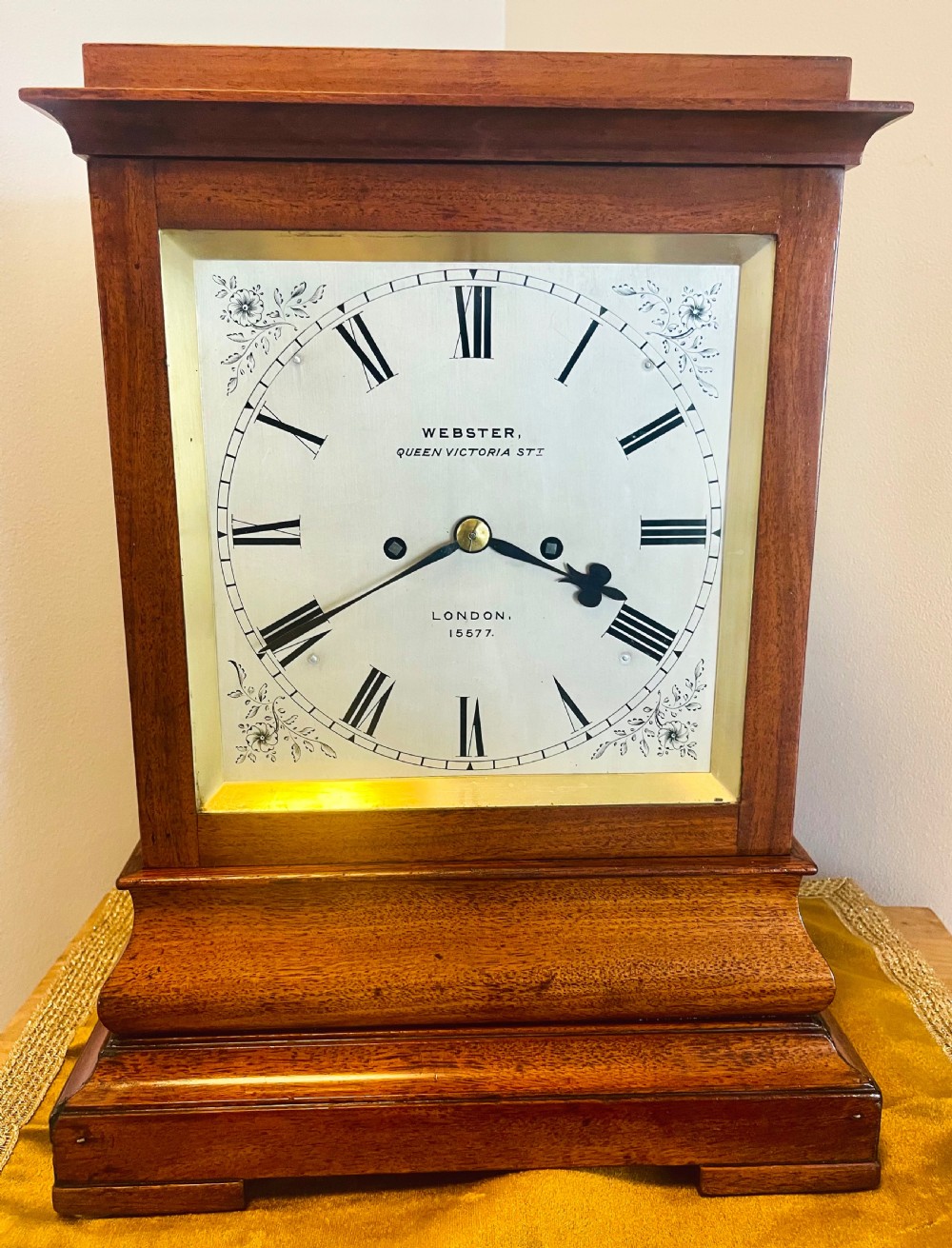 A Victorian mahogany four-glass bracket clock featuring a white dial with Roman numerals and a moulded stepped base. View IX