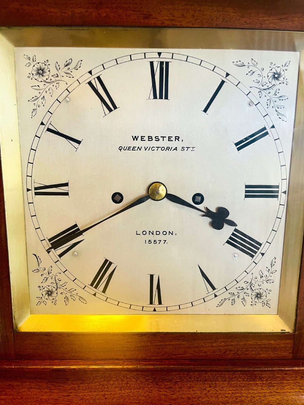 A Victorian mahogany four-glass bracket clock featuring a white dial with Roman numerals and a moulded stepped base. View X