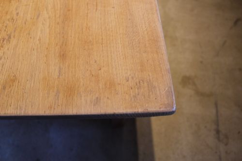 fig 1. An Edwardian light oak farmhouse refectory dining table featuring straight square legs and a spacious rectangular plank top.