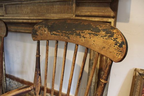 fig 3. A pair of late 19th-century Windsor armchairs featuring shaped elm seats, spindle backs, turned legs, and distressed dark brown patinated finish.