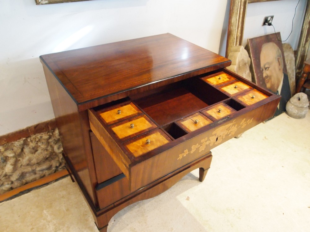 A warm brown Italian timber commode featuring decorative botanical marquetry inlays, two drawers, and square tapered feet. View II