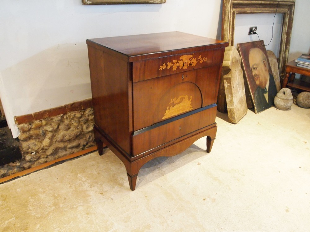 A warm brown Italian timber commode featuring decorative botanical marquetry inlays, two drawers, and square tapered feet. View III