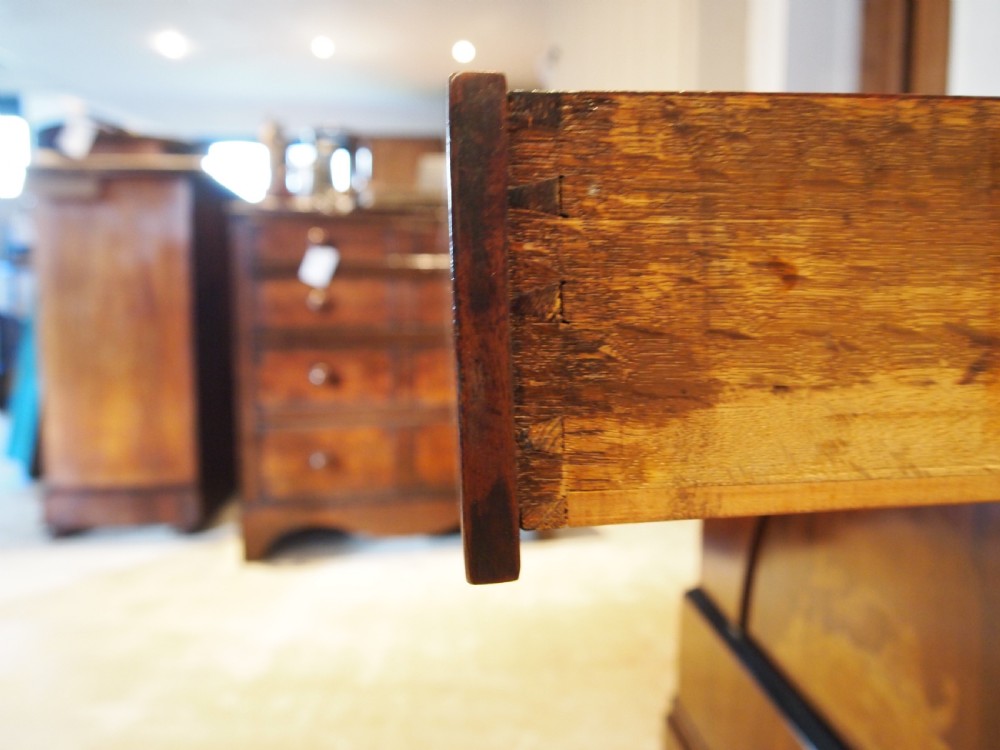 A warm brown Italian timber commode featuring decorative botanical marquetry inlays, two drawers, and square tapered feet. View VII